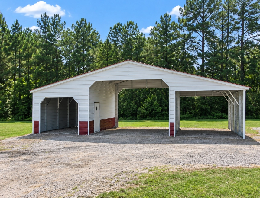 Red metal barn with horses and tractor